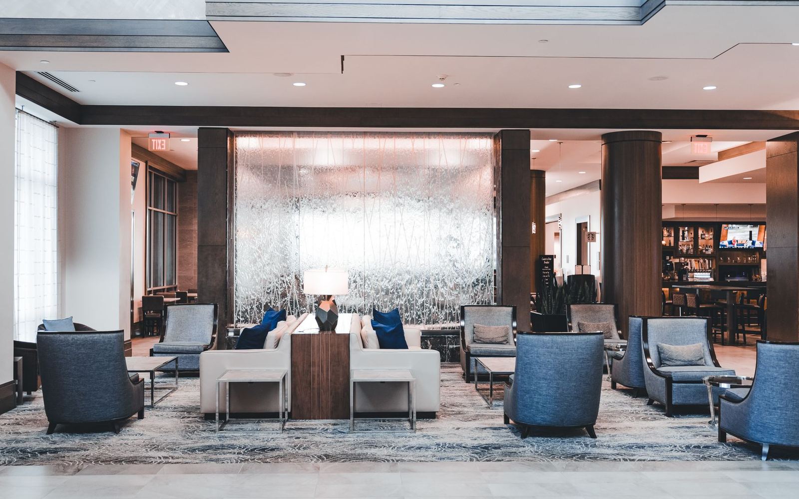 A hotel lobby with seating, ready for guests